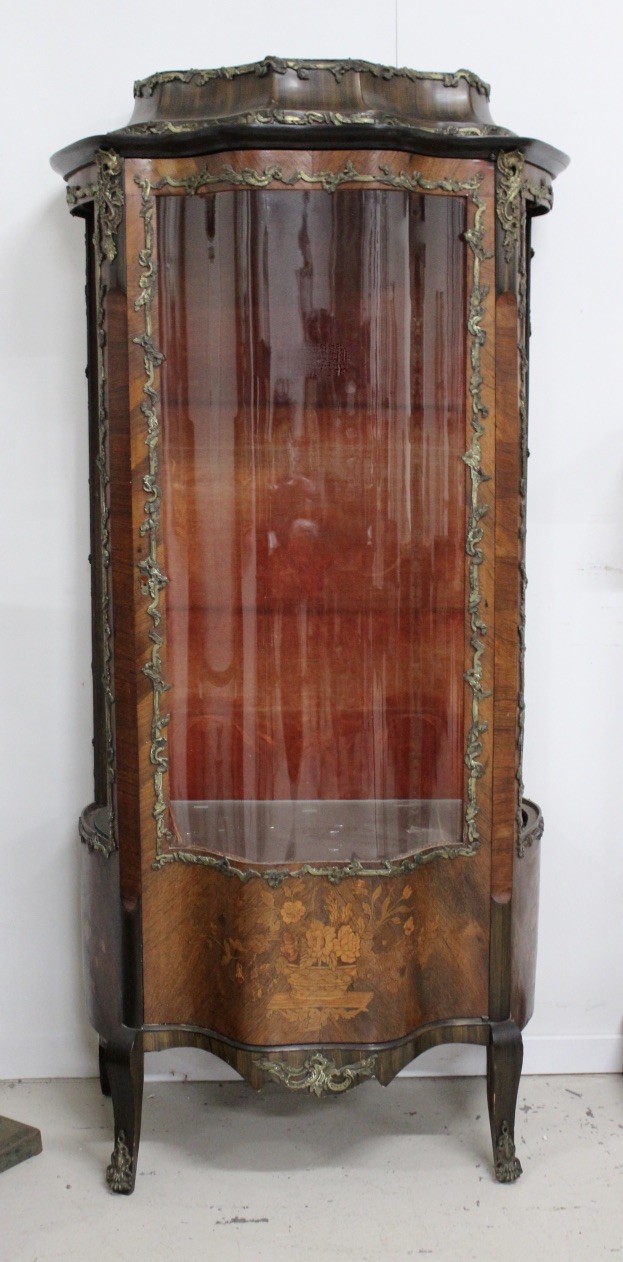 Mid 19th centruy French alnut and floral marquetry inlaid single door vitrine, having bronze mounts. Price $1800.