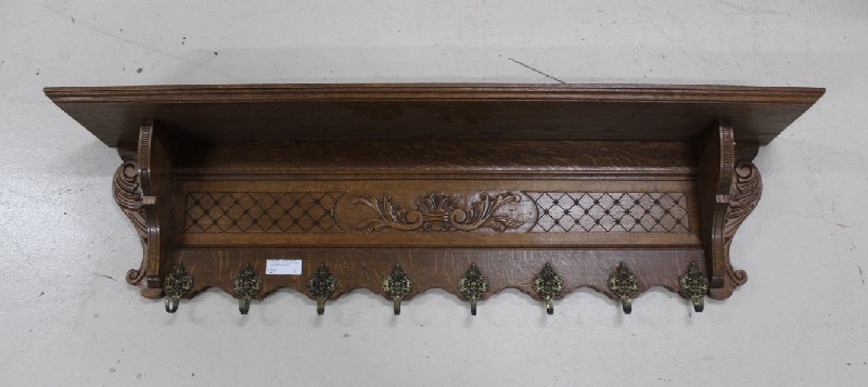 Large French carved oak coat rack with figured bronze hooks. Price $440