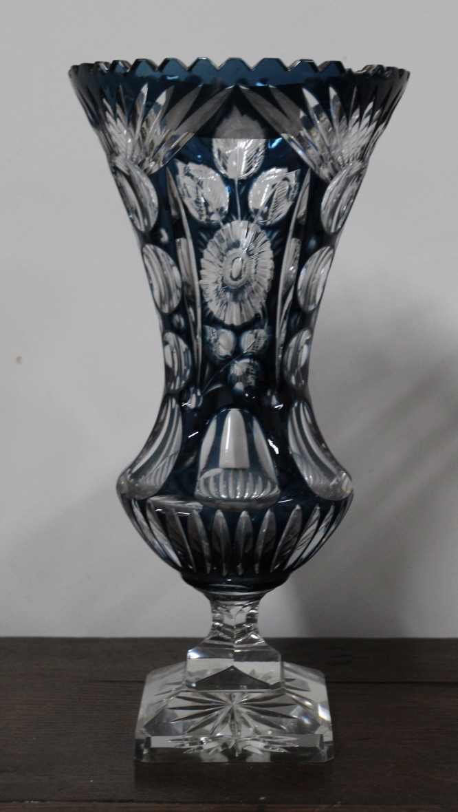 Heavy blue and clear cut crystal vase on square base. Price $495