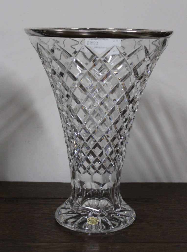 Diamond cut crystal flared vase with silver plated rim. Price $380
