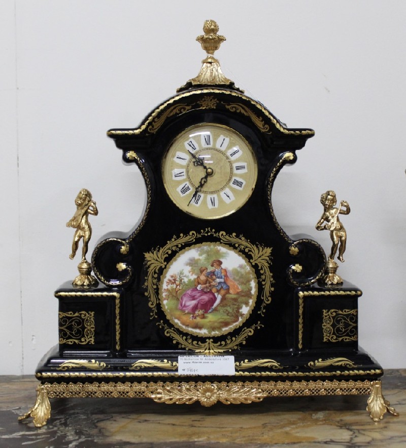 French Limoges Sevres style blue porcelain and brass mounted mantle clock. Price $625