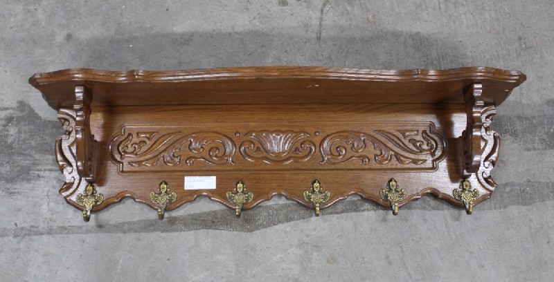 French carved oak wall coat rack with bronze hooks. Price $220