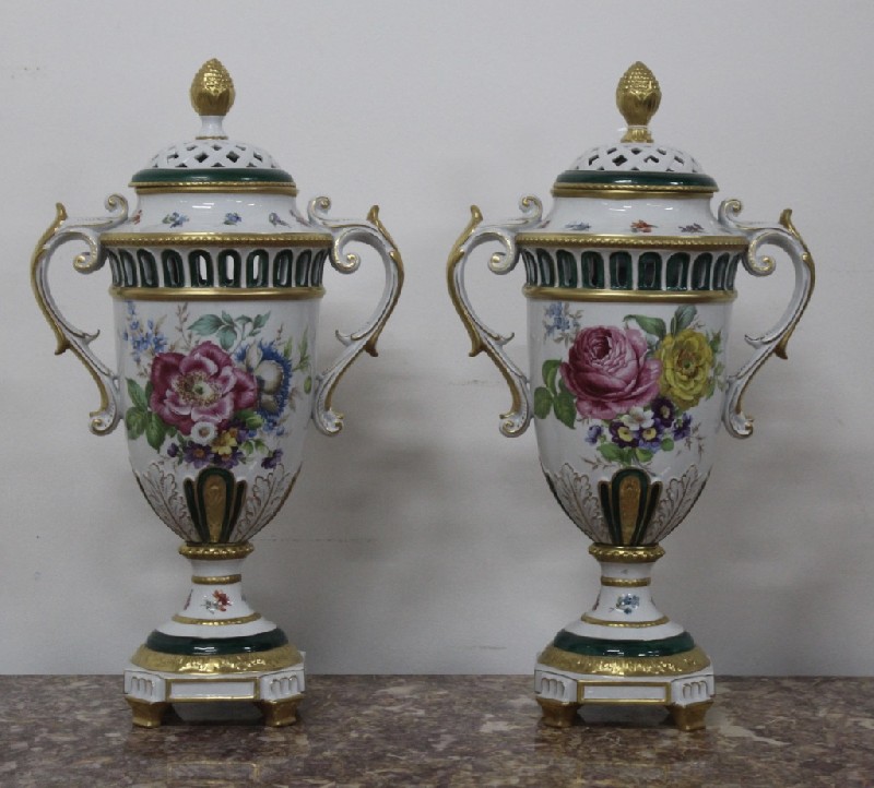 Fine pair of Italian Royal Napels 2 handled porcealin covered vases, having hadpainted floral panels and extensive gilding. Price $1500 pair.