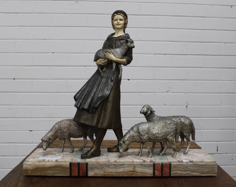 Art deco spelter maiden statue with sheep on multi coloured marble base. Price $1350