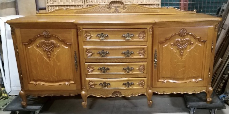 French provincial oak & floral carved two door and four drawer buffet. Price $1500